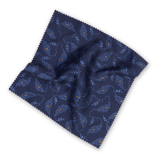 A luxury microfibre lens cloth in navy blue with a V&A Archive pattern